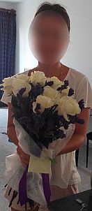 Pretty woman with Bouquet of 11 white Roses